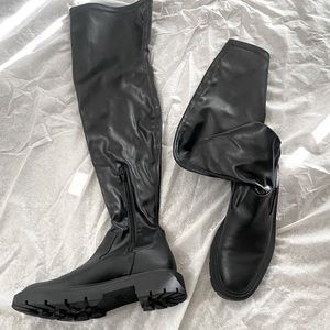 Black leather thigh high boots